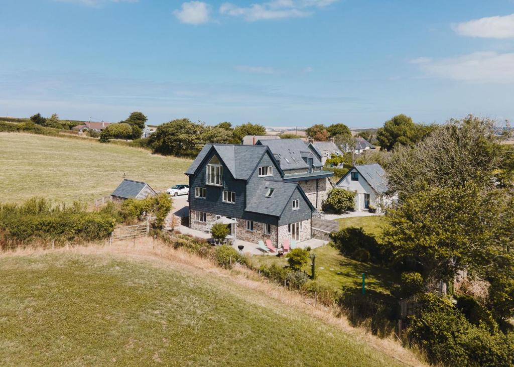 an aerial view of a large house in a field at Daydreamer Cottage in Padstow