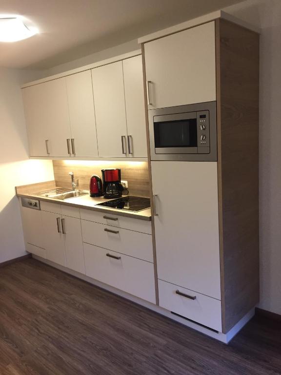 Kuchyň nebo kuchyňský kout v ubytování Hotel Garni Ingeborg