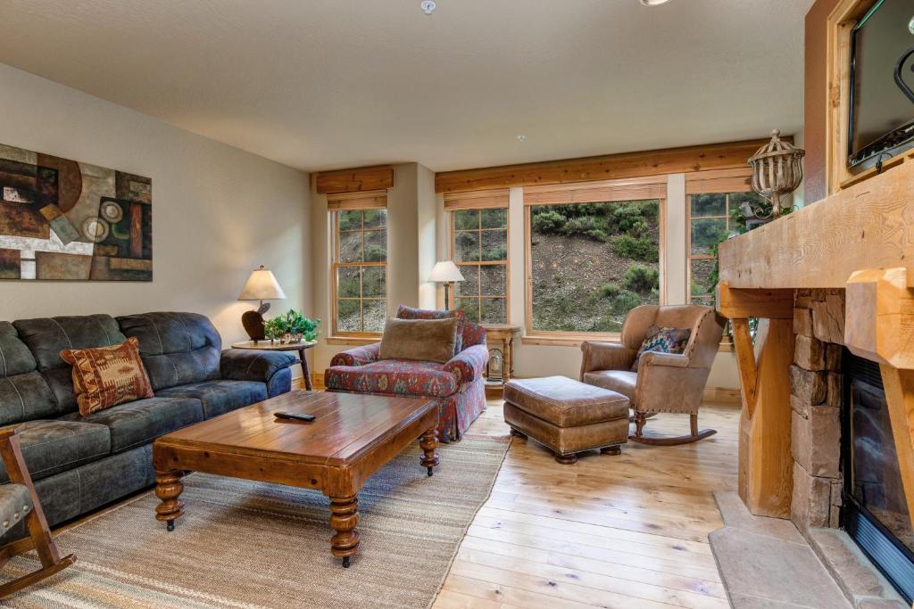 a living room with a couch and a fireplace at Lodges at Deer Valley - #2218 in Park City