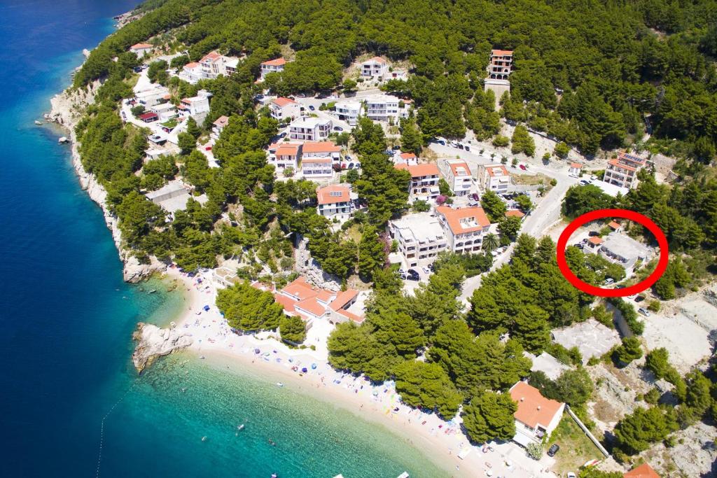 a house on an island with a red circle on it at Apartment Brela 6056a in Brela