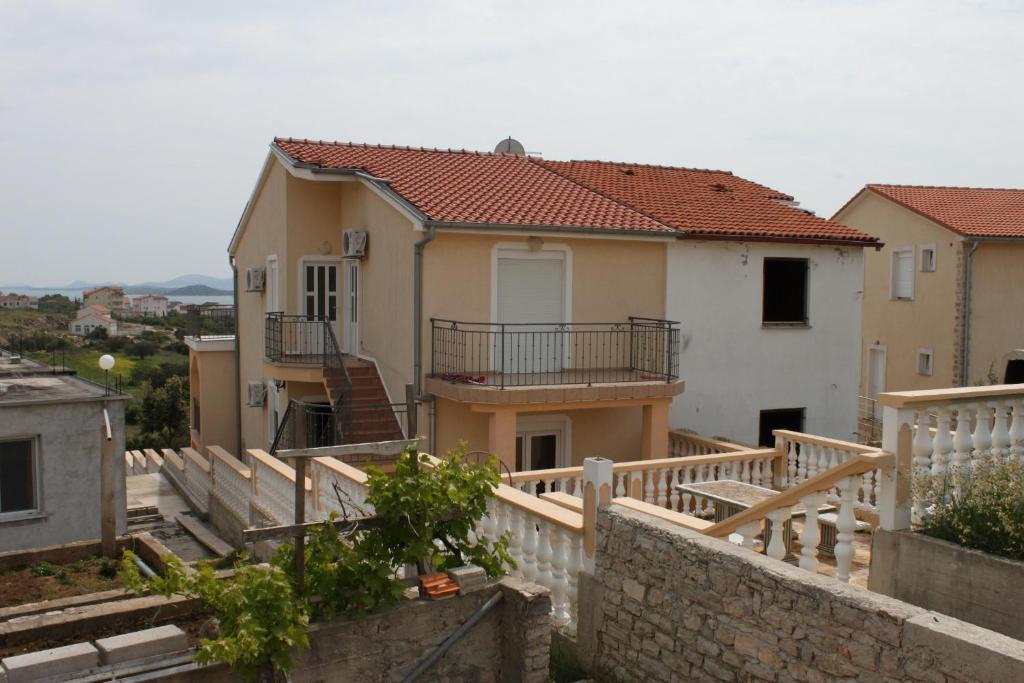 a view of a house with a balcony at Apartments with a parking space Sveti Petar, Biograd - 6169 in Sveti Petar