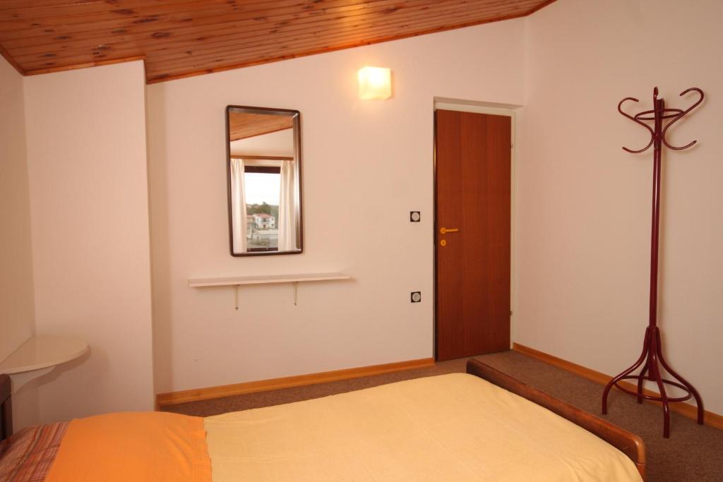 Postel nebo postele na pokoji v ubytování Apartment Manjadvorci 7445a