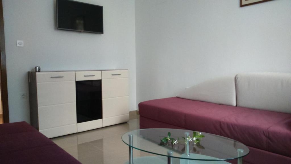 a living room with a couch and a table at Apartments with a parking space Rabac, Labin - 7442 in Rabac