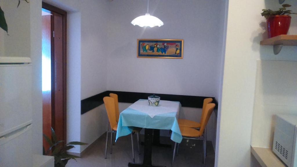 a table in a room with a blue table cloth at Apartments with a parking space Rabac, Labin - 7442 in Rabac