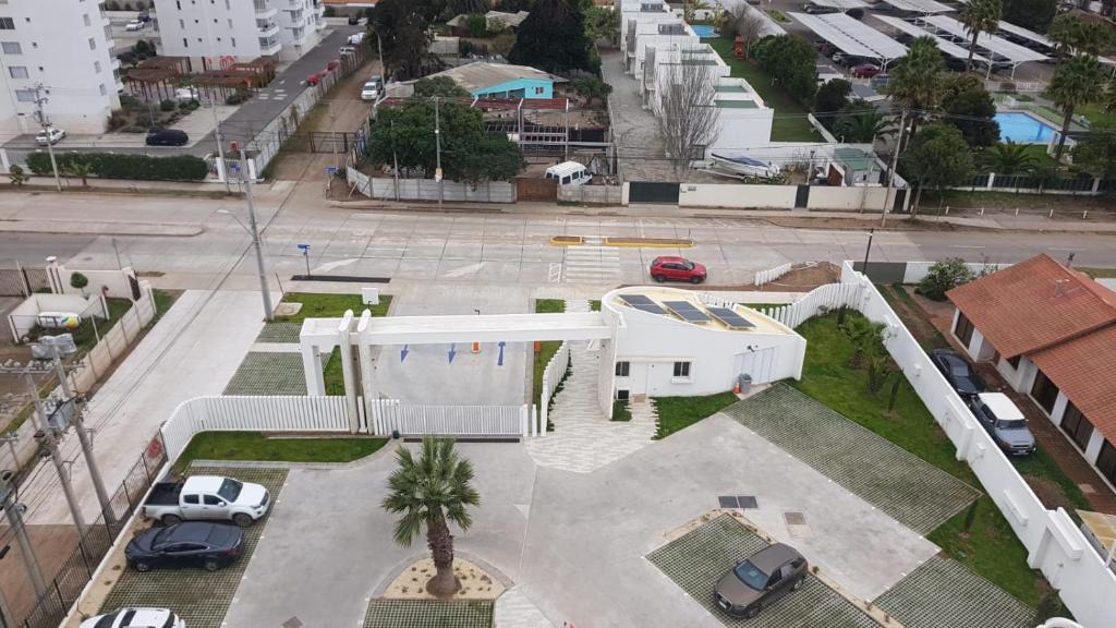 an aerial view of a white building with a parking lot at Departamento en La Serena in La Serena