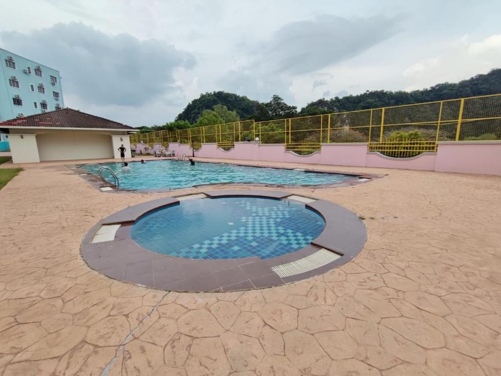 a large swimming pool in the middle of a building at Homestay 116 in Ipoh