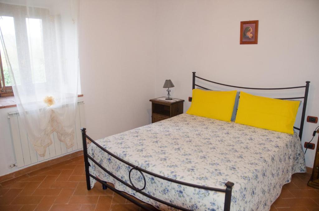 Postel nebo postele na pokoji v ubytování Agriturismo podere Casano
