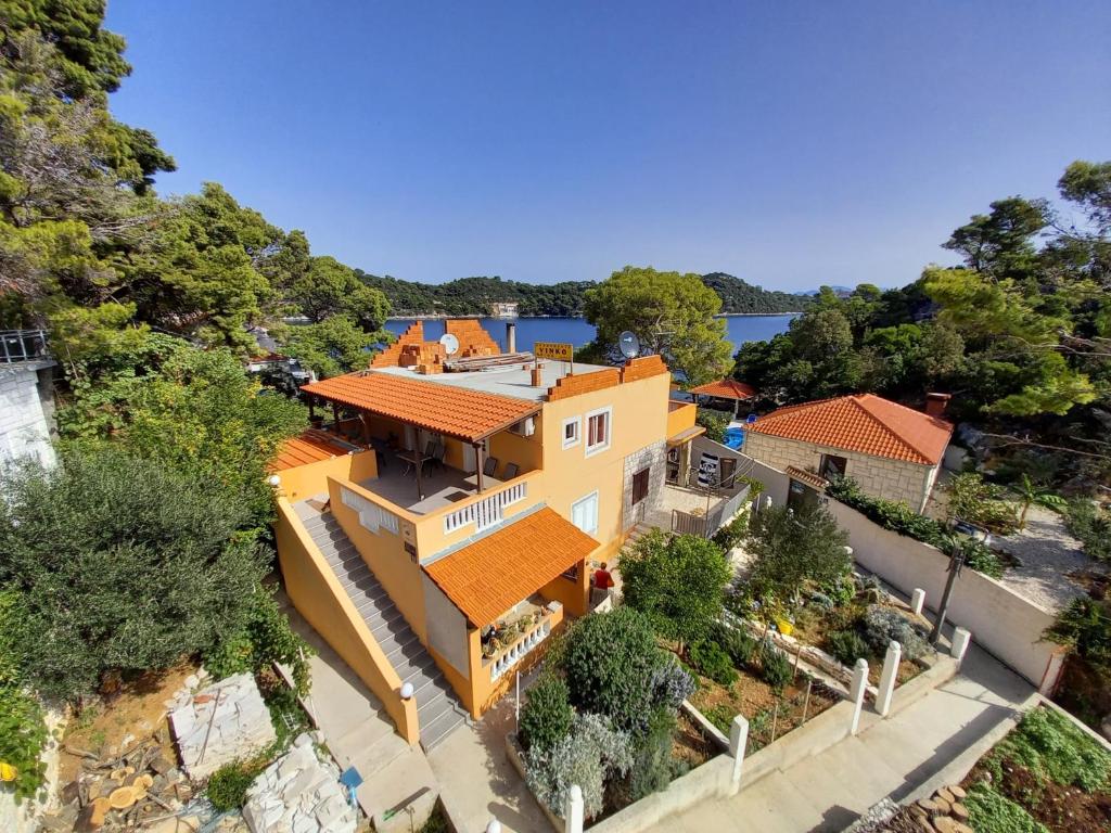 an aerial view of a house with orange roof at Apartments by the sea Sobra, Mljet - 7531 in Sobra