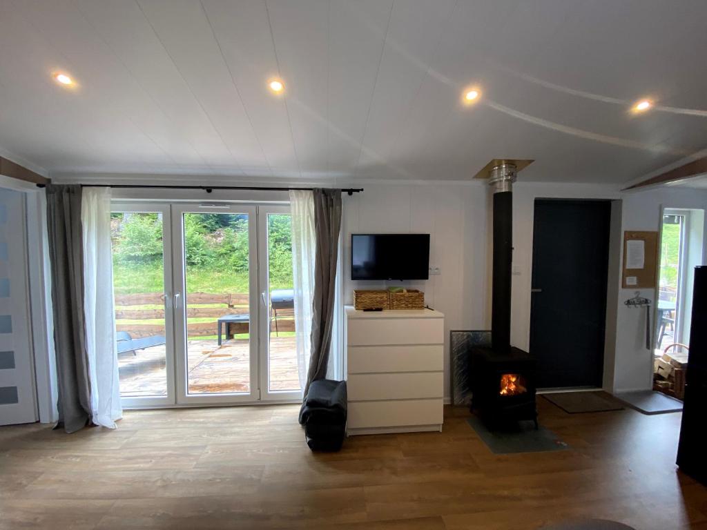 TV a/nebo společenská místnost v ubytování Tiny house