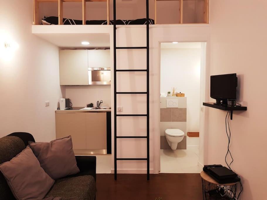 a living room with a bunk bed in a room at STUDIO MARCHE PROVENCAL in Antibes