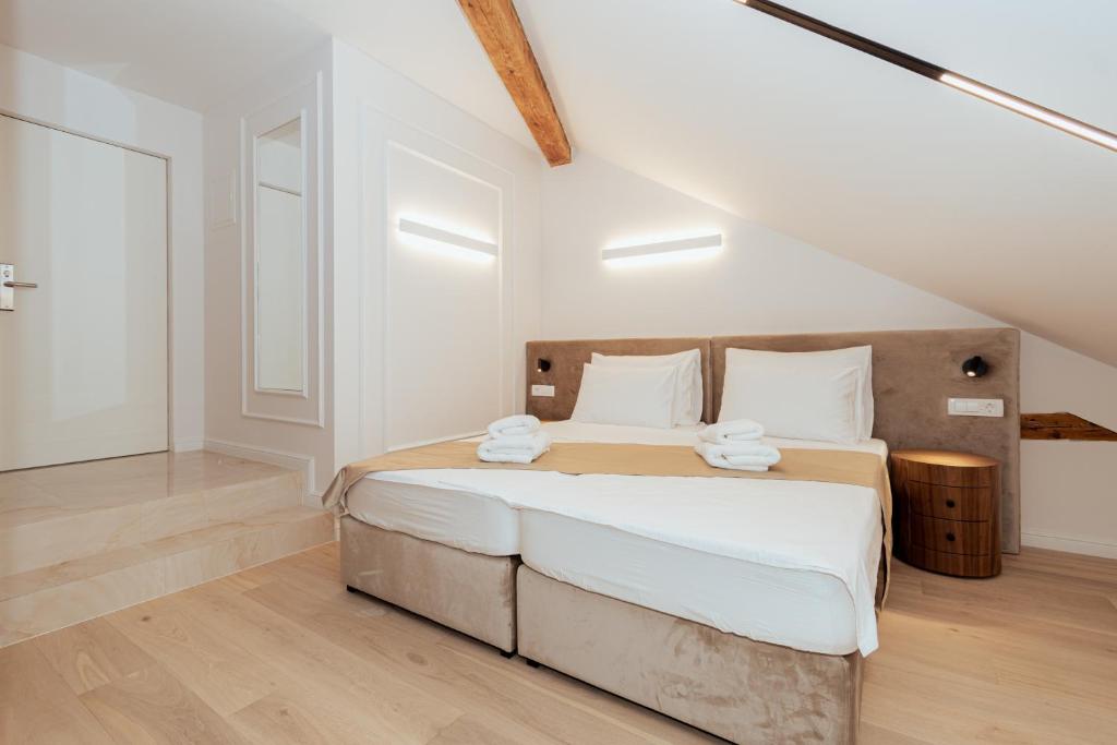 Postel nebo postele na pokoji v ubytování Trecento Boutique Rooms