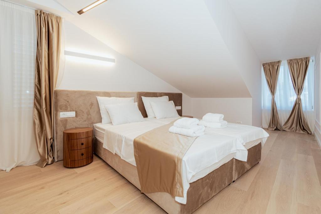 Postel nebo postele na pokoji v ubytování Trecento Boutique Rooms