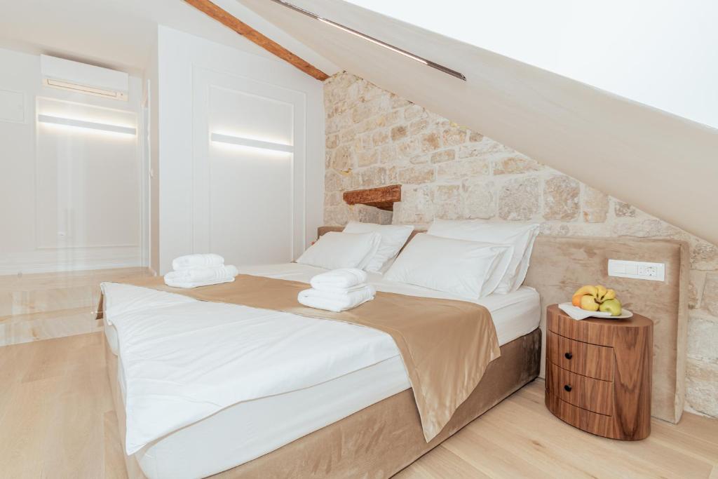 Postel nebo postele na pokoji v ubytování Trecento Boutique Rooms
