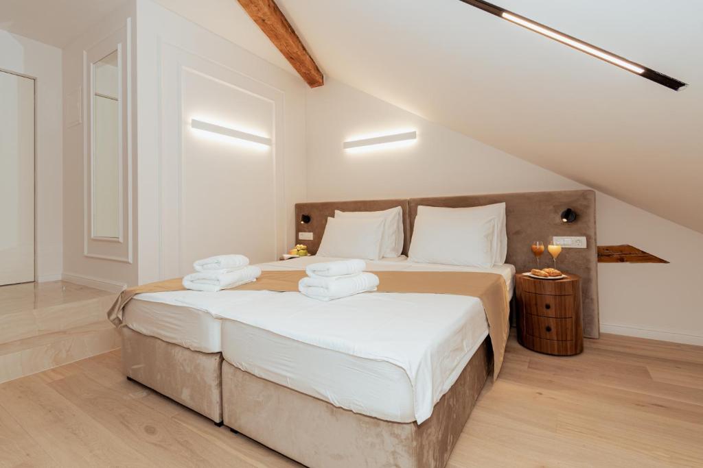 Postel nebo postele na pokoji v ubytování Trecento Boutique Rooms
