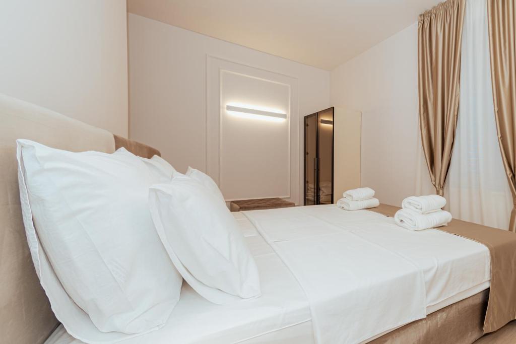 Postel nebo postele na pokoji v ubytování Trecento Boutique Rooms
