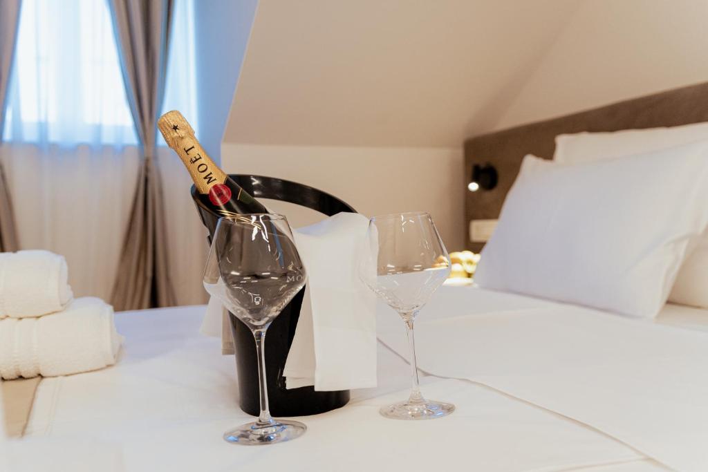 Postel nebo postele na pokoji v ubytování Trecento Boutique Rooms