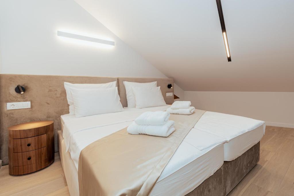 Postel nebo postele na pokoji v ubytování Trecento Boutique Rooms