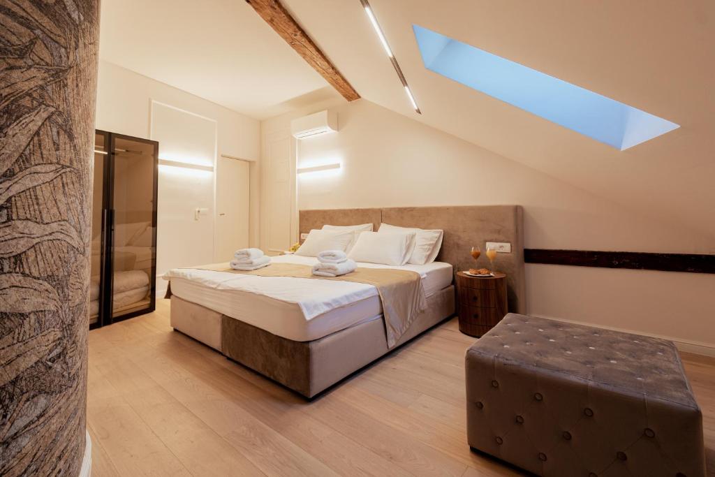Postel nebo postele na pokoji v ubytování Trecento Boutique Rooms