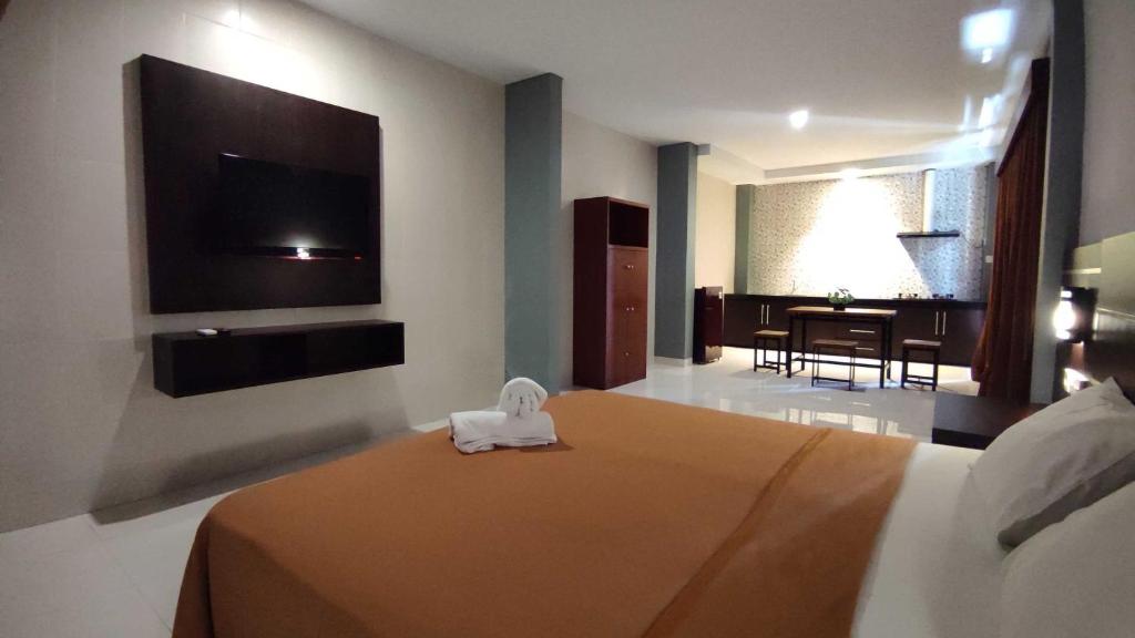 Postel nebo postele na pokoji v ubytování Gempita House Bali
