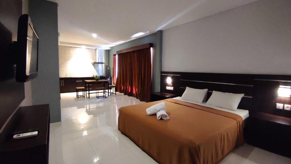 Postel nebo postele na pokoji v ubytování Gempita House Bali