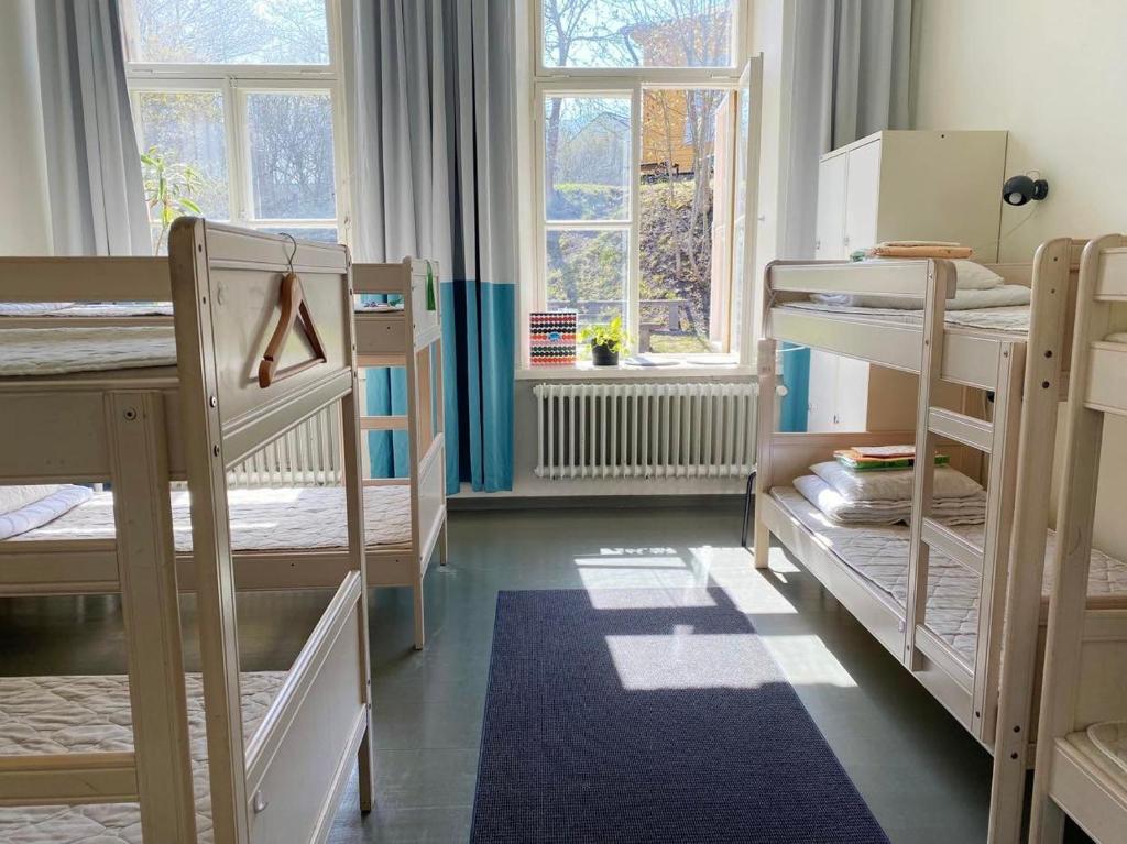 Postel nebo postele na pokoji v ubytování Hostel Suomenlinna