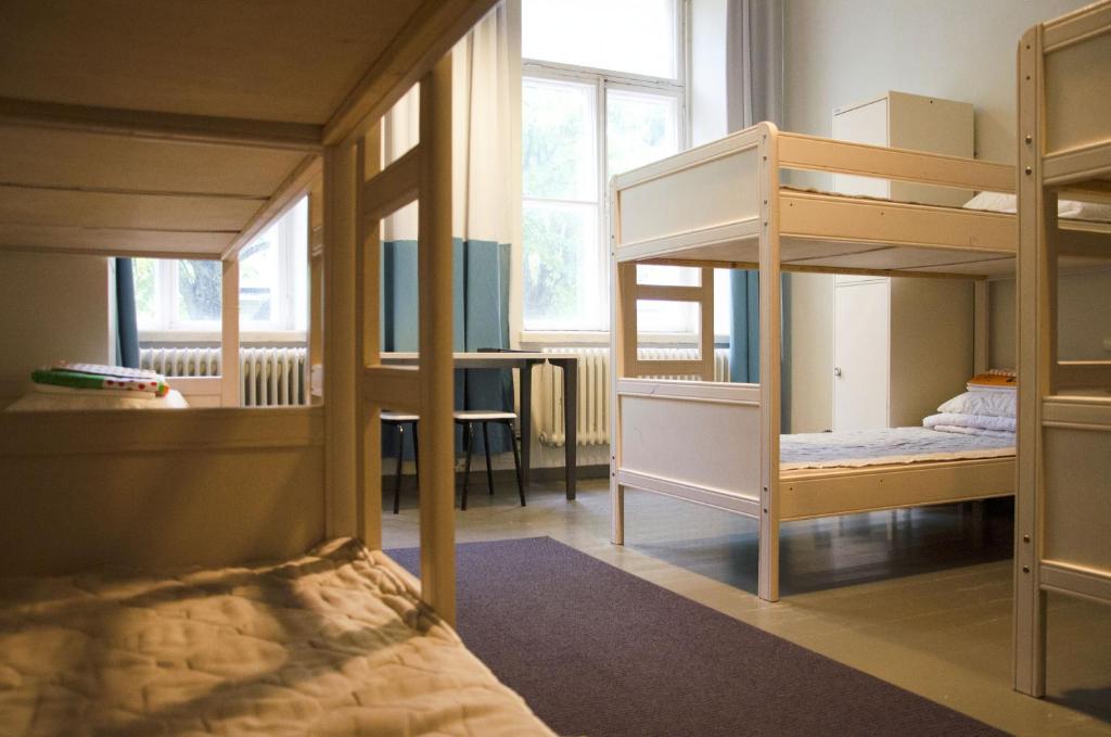 Postel nebo postele na pokoji v ubytování Hostel Suomenlinna