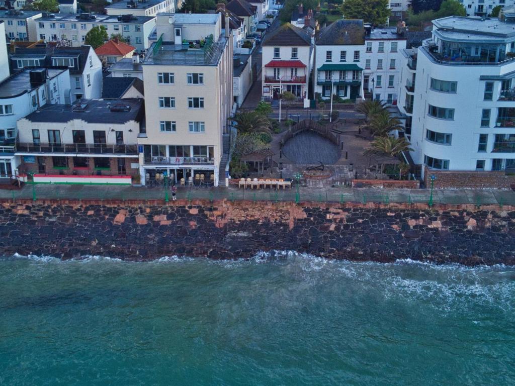 an aerial view of a city and the ocean at Marina Metro Hotel in Saint Helier Jersey