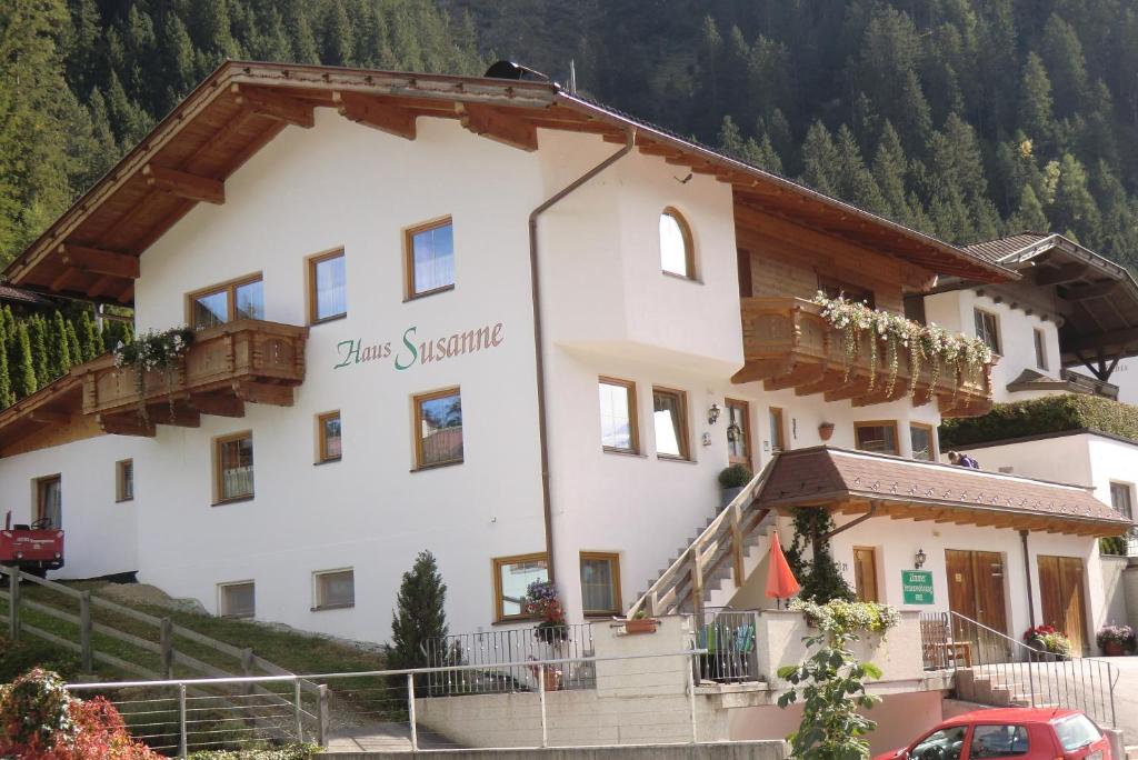 a large white building with a sign on it at Haus Susanne in Neustift im Stubaital