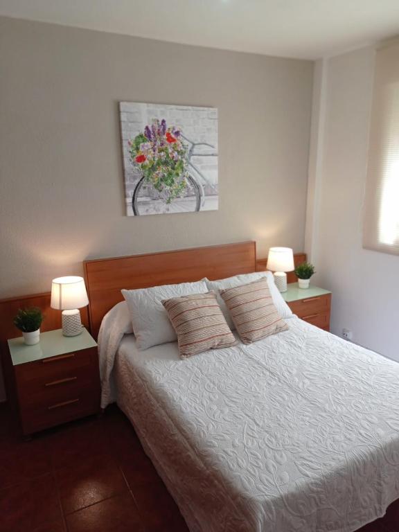 Llit o llits en una habitació de MALAGA EXPERIENCE