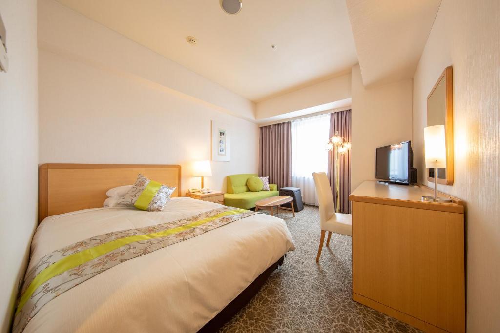 Postel nebo postele na pokoji v ubytování President Hotel Mito