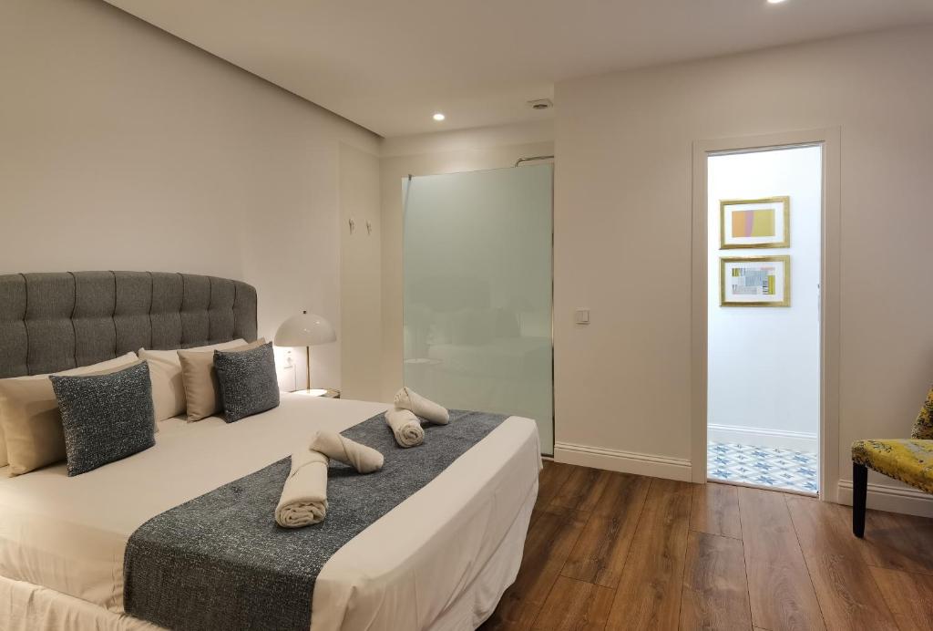 Postel nebo postele na pokoji v ubytování Torres de Serranos Apartments - TTdSSa VLC