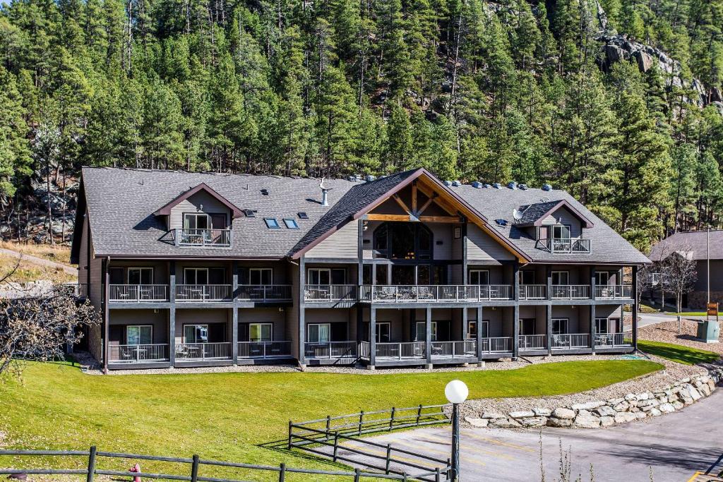 a large building with a view of a lake at K Bar S Lodge, Ascend Hotel Collection in Keystone
