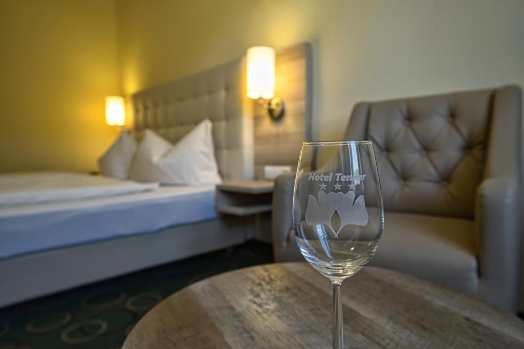 Postel nebo postele na pokoji v ubytování Hotel Tenner