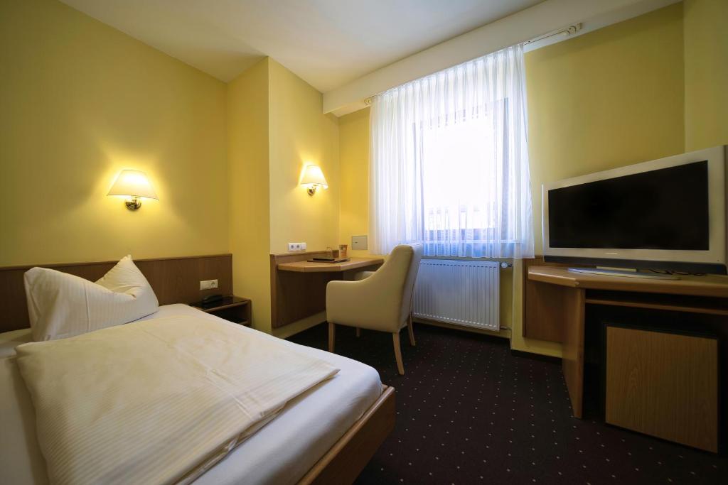 TV a/nebo společenská místnost v ubytování Hotel Tenner