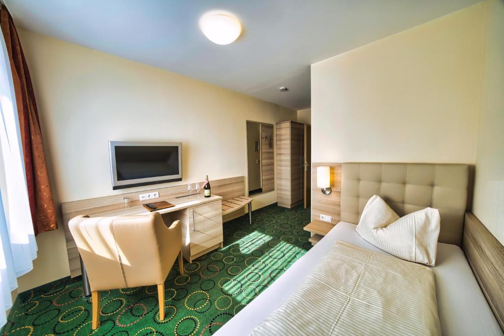TV a/nebo společenská místnost v ubytování Hotel Tenner