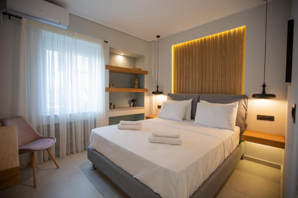 Postel nebo postele na pokoji v ubytování Vallia Suites - Luxury Suite B2