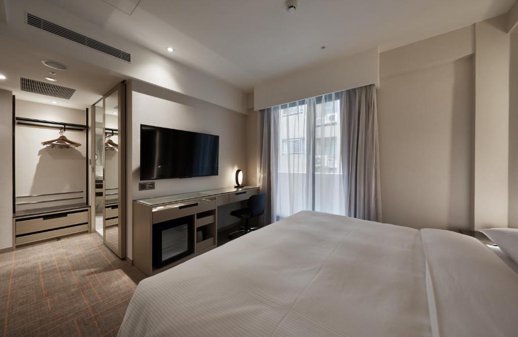 Postel nebo postele na pokoji v ubytování K Hotels Taipei Linsen