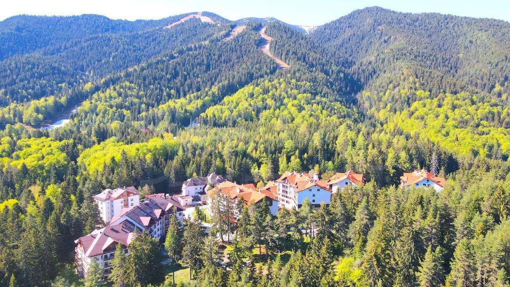 a small town in the middle of a mountain at Borovets Ski&Spa Studio - Semiramida Garden A16 in Borovets
