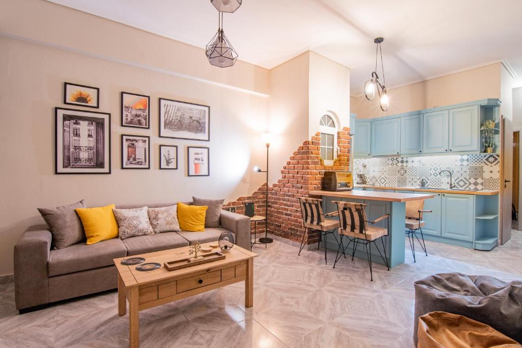 a living room with a couch and a table at Vintage apartment in athens-zografou in Athens