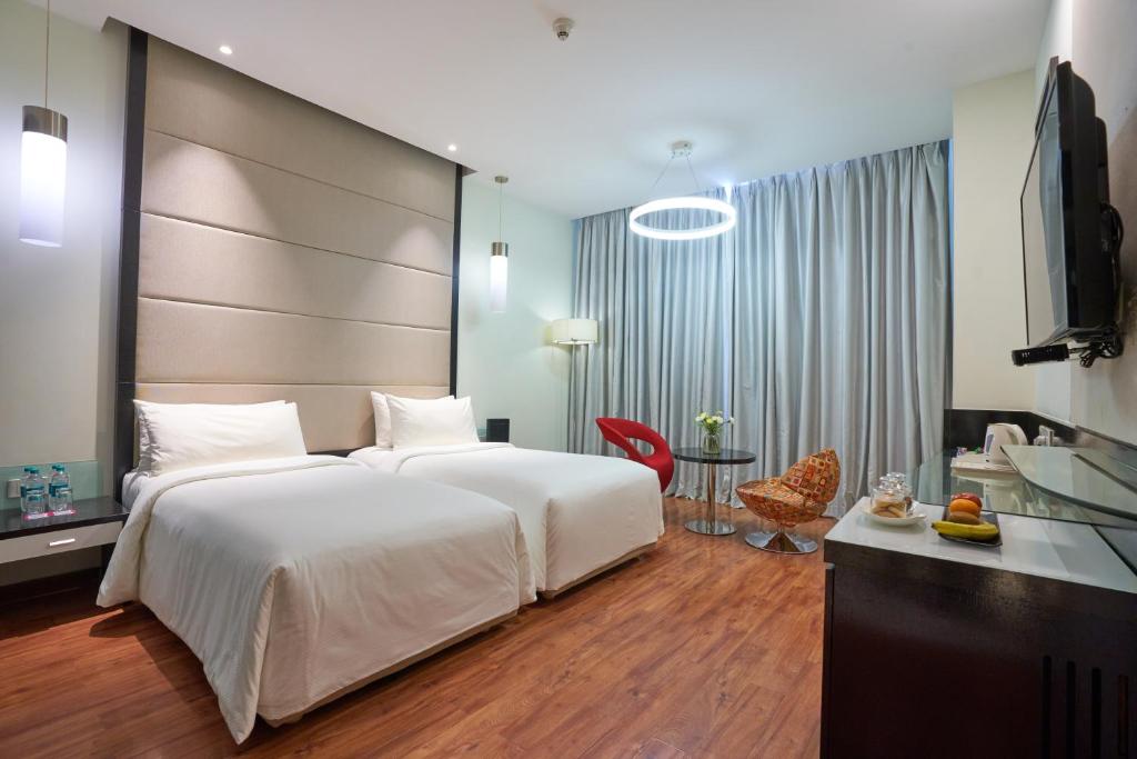 Postel nebo postele na pokoji v ubytování E Hotel