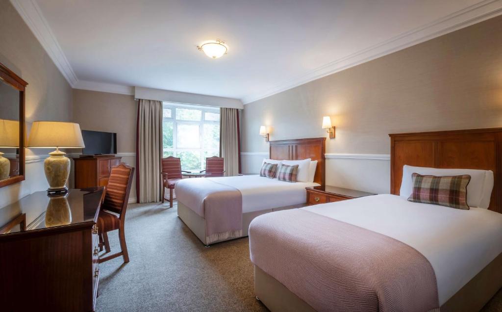 Postel nebo postele na pokoji v ubytování Court Yard Hotel