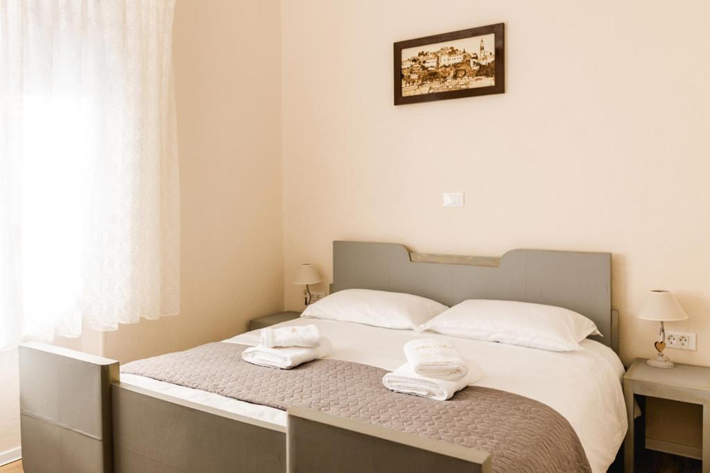 Postel nebo postele na pokoji v ubytování Vila Ana