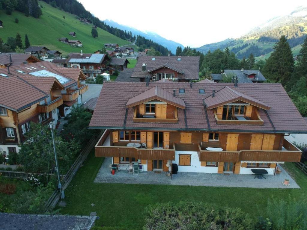 an aerial view of a house in a mountain at Apartment Am Liimerweg by Interhome in Adelboden