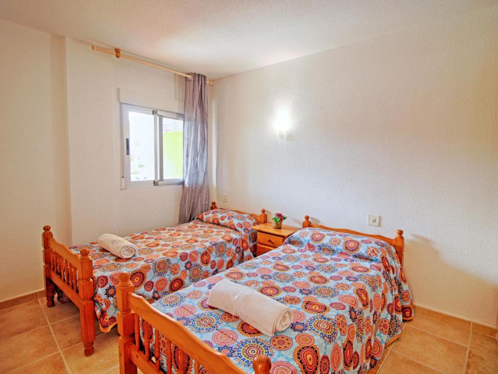 Posteľ alebo postele v izbe v ubytovaní Apartment Voramar-8 by Interhome