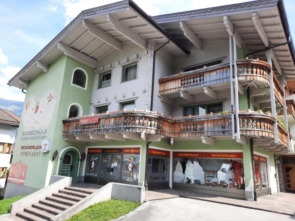 a building with balconies on the side of it at Appartementhaus Kostenzer in Fügen