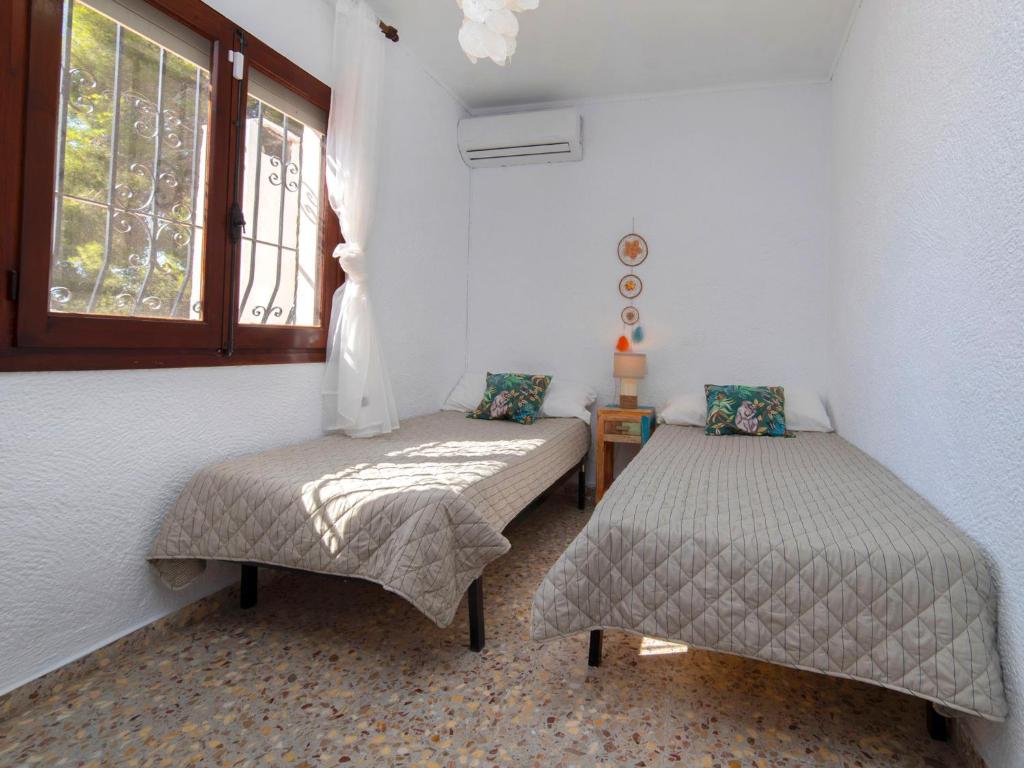 Postel nebo postele na pokoji v ubytování Holiday Home La Marina by Interhome
