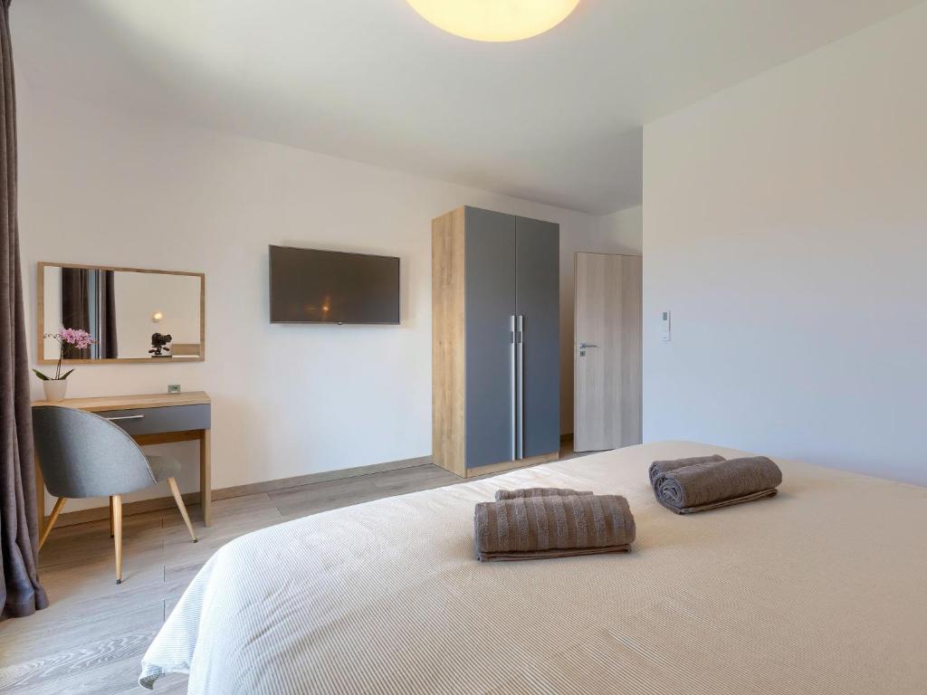 Posteľ alebo postele v izbe v ubytovaní Holiday Home Villa Essea by Interhome