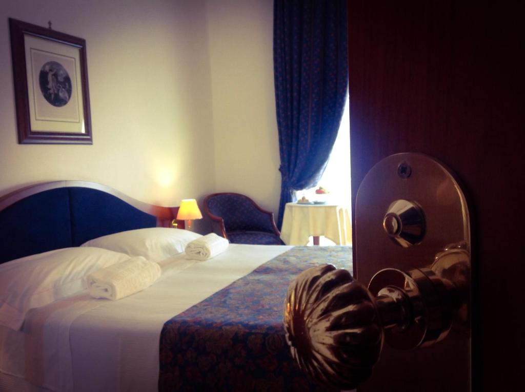 Posteľ alebo postele v izbe v ubytovaní Massimo Plaza Hotel