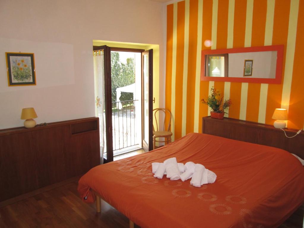 Postel nebo postele na pokoji v ubytování Cascina Roland