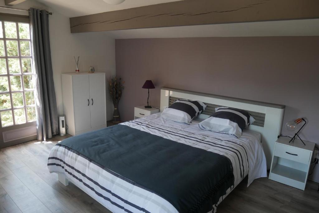 Posteľ alebo postele v izbe v ubytovaní La Petite Maison